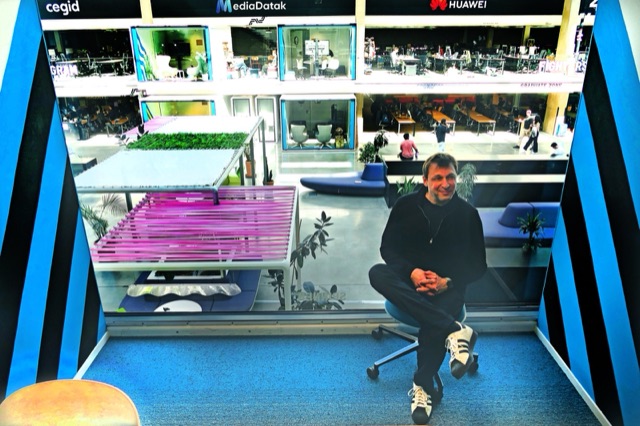 Samuel Zniber seated above the Station F floor, Paris